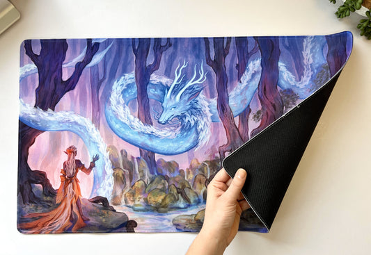 A female elf dressed in pale orange receives her magic from her clan's guardian dragon, a long silver serpent with horns that weaves through the trees.